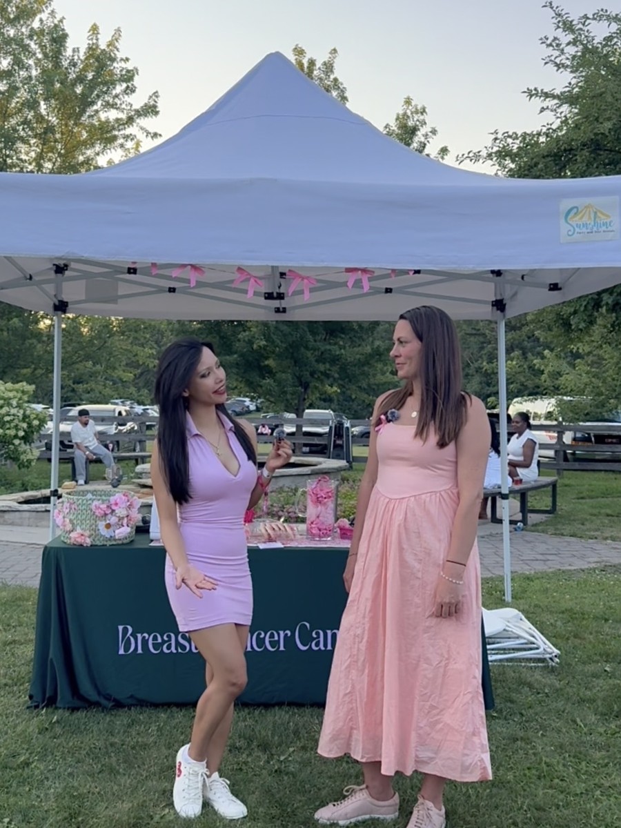 Rachel Dragas interviewing a representative at the Breast Cancer Canada tent, Rosé Picnic 2026